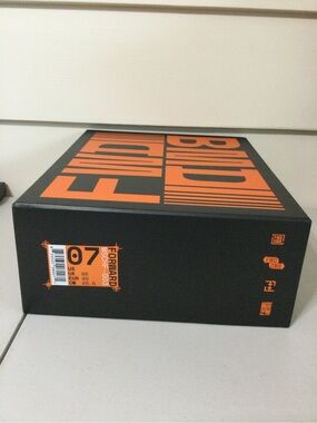 MSCHF Black and Orange Shoe Box with Bold Typography